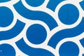 Closeup of a blue and white rotating pattern on the wall