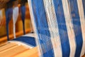 Closeup of Blue and white striped warp. Weaving. Handweaving. Textiles. Fiber.