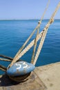 Closeup Of Bollard With Mooring Ropes