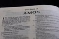 Closeup of the Book of Amos from Bible or Torah, with focus on the Title of Christian and Jewish religious text.