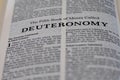 Closeup of the Book of Deuteronomy from Bible or Torah, with focus on the Title of Christian and Jewish religious text. Royalty Free Stock Photo