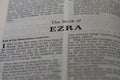 Closeup of the Book of Ezra from Bible or Torah, with focus on the Title of Christian and Jewish religious text. Royalty Free Stock Photo