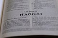 Closeup of the Book of Haggai from Bible or Torah, with focus on the Title of Christian and Jewish religious text. Royalty Free Stock Photo