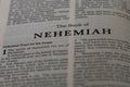 Closeup of the Book of Nehemiah from Bible or Torah, with focus on the Title of Christian and Jewish religious text. Royalty Free Stock Photo