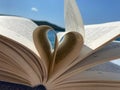 Closeup of book pages shaped as a heart