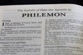 Closeup of the Book of Philemon from Bible, with focus on the Title of religious text. Royalty Free Stock Photo