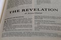 Closeup of the Book of Revelation from Bible, with focus on the Title of religious text. Royalty Free Stock Photo