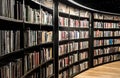 Closeup of book shelves inside Birmingham library light around beige floor