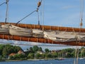 Closeup of a boom with a closed sail of a sailing boat Royalty Free Stock Photo