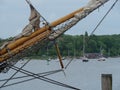 Closeup of a boom with a closed sail of a sailing boat on a gloomy day Royalty Free Stock Photo