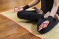 Closeup of Both Hands of Caucasian Brunette Woman Practicing Yoga Indoors. Doing Sukhasana Exercises In Lotus Therapy Pose. Royalty Free Stock Photo