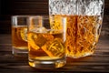 Closeup of bottle and two glasses with ice and whiskey Royalty Free Stock Photo