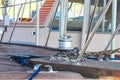Closeup of bow on old wooden boat with anchor chain and mooring rope with other boats blurred behind Royalty Free Stock Photo