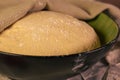 Closeup of a bowl filled with dough covered by a towel Royalty Free Stock Photo