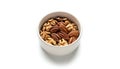 Closeup of a bowl filled with walnuts and pecans on a clean white background Royalty Free Stock Photo