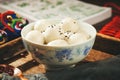 Closeup of a bowl of glutinous rice balls on the table in a Chinese restaurant