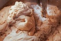Closeup of a bowl of kneaded dough