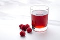Closeup of glass of fresh raspberry drink on the white marble table.Empty space Royalty Free Stock Photo
