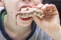 Closeup of boy eating sweet sandwich with chocolate Royalty Free Stock Photo