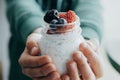 Closeup Boy hands with Pudding with chia seeds, yogurt and fresh Royalty Free Stock Photo