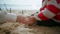 Closeup boy playing sand on ocean shore. Focused child hands building castle