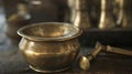 A closeup of a brass mortar and pestle used for grinding and blending various herbs and substances as described in Royalty Free Stock Photo