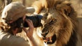 closeup of a brave photographer capturing a fierce lion