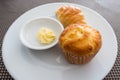 Closeup bread rolls in mold on wood table with milk cream Royalty Free Stock Photo