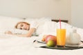 Closeup of breakfast in front of sleeping woman