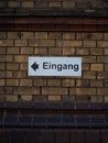 Closeup of a brick wall with Eingang - Entrance sign