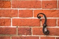 Closeup brick wall with iron scroll detail-background texture