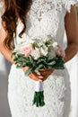 Close-up bridal bouquet of spring pink and white flowers on a blurred background, selective focus Royalty Free Stock Photo