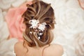 Closeup of Bridal wedding hairstyle with jewelry wreath. Back view. Elegant bride with Wavy hair