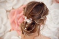 Closeup of Bridal wedding hairstyle with jewelry wreath. Back view. Elegant bride with Wavy hair