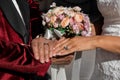 Closeup of bride and groom holding hands and showing rings on Wedding day, special occasion Royalty Free Stock Photo