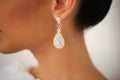 Closeup with bride`s elegant crystal ear rings Royalty Free Stock Photo