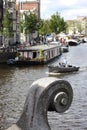 Closeup of bridge ornament closeup, boats on Amstel, Amsterdam Royalty Free Stock Photo