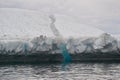 Closeup of bright blue ice visible inside iceberg in Twillingate Harbour