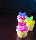 Bright color spring decorated cupcakes with butterflies Royalty Free Stock Photo