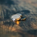 Closeup of British coins on a wooden surface Royalty Free Stock Photo