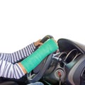 Closeup of a broken arm in a cast diving car on white b