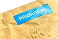 Envelope with blue prioritaire mail sticker Royalty Free Stock Photo