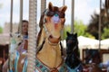 Closeup of a brown horse on the merry-go-round.