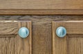 Brown rustic wooden cupboard doors and handles. Royalty Free Stock Photo