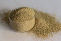 Closeup of browntop millet grains in a pristine glass bowl filled to the brim