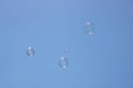 Closeup of bubbles floating in background of blue sky Royalty Free Stock Photo