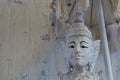 Closeup of a buddha statue under a umbrella, Buddhism a spiritual background