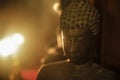 Closeup Buddha statue with warm light. Royalty Free Stock Photo