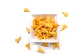 bugles salted appetizers in a white bowl on top view on white background Royalty Free Stock Photo