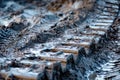 closeup of bulldozer tracks in muddy terrain Royalty Free Stock Photo